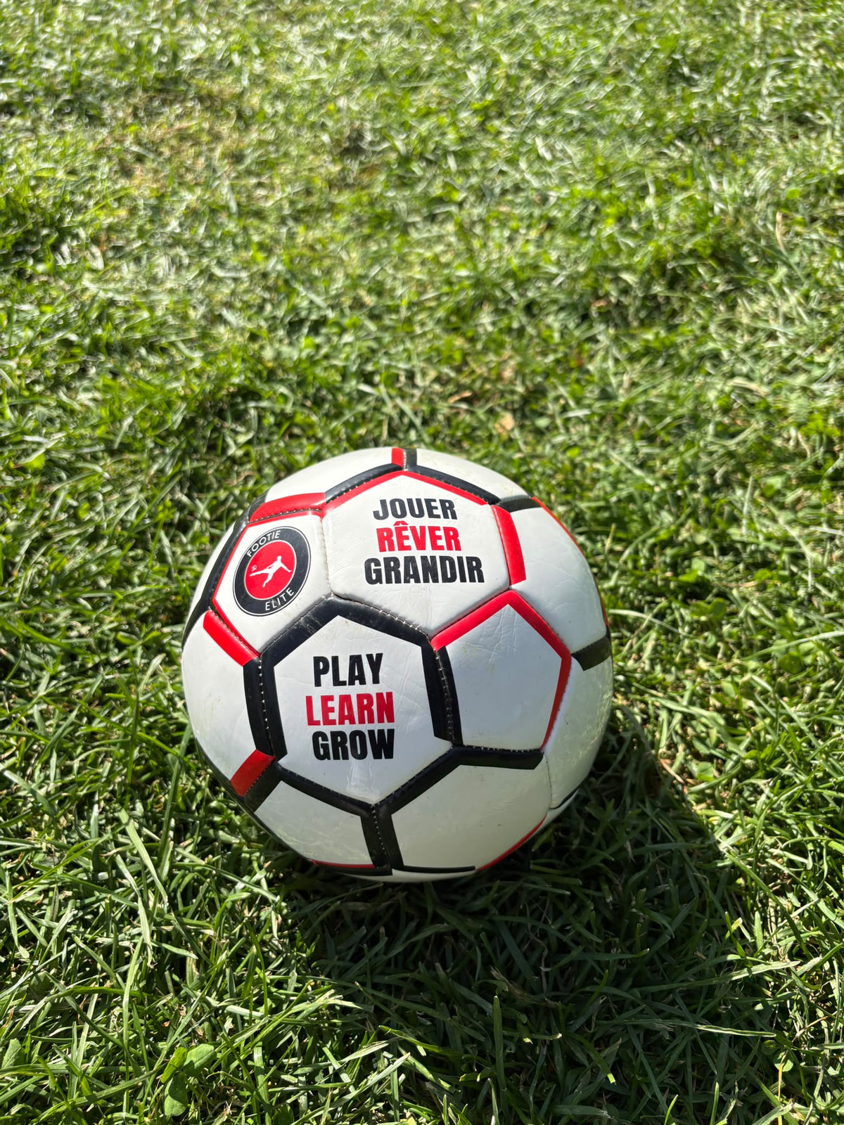 Footie Elite soccer ball with bilingual Play Learn Grow branding